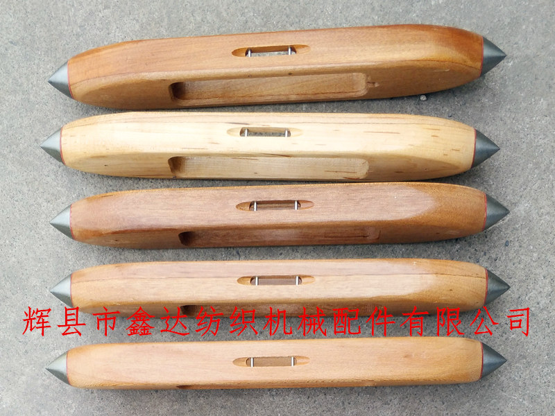 Handmade wooden shuttle with pictures of textile equipment Hand woven wooden shuttle